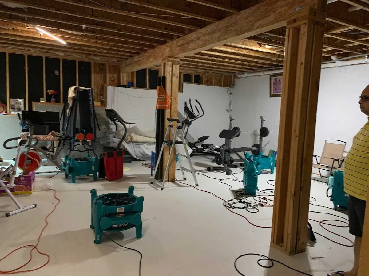Basement drying equipment setup for Contents Cleaning & Restoration in East Greenbush
